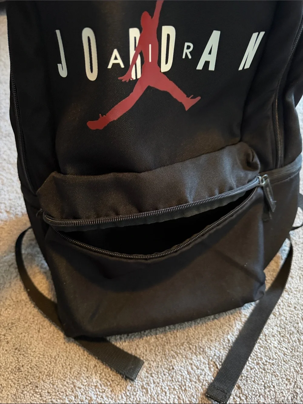 Black Jordan Backpack with Red Jumpman and White Lettering